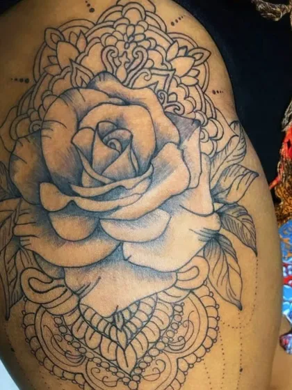 The completed line work for the rose and mandala hip tattoo. This design is ready for shading, which will add depth and bring the flower to life.