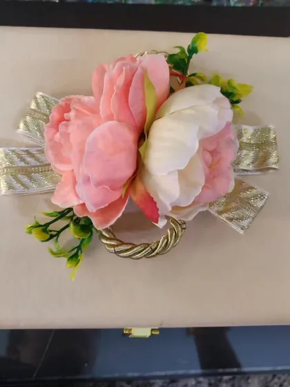 A top-down view of the elegant floral arrangement on the lid of our custom trunk box.