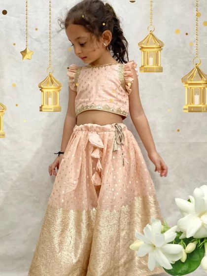 Our periwinkle lehenga, as worn by an adorable little client. This soft peach outfit with gold accents is both comfortable and festive.