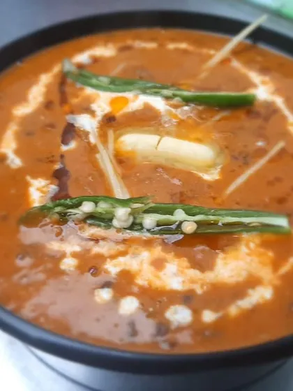 Our Dal Makhan Wali, also known as Dal Makhani, is rich, creamy, and topped with butter. It's the perfect comfort food for any meal.