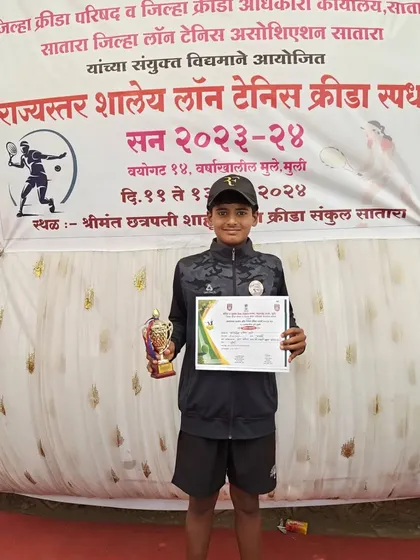 Rishikesh Mane with his certificate and trophy confirming his selection for the Maharashtra national team.