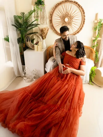 I love capturing the looks you share. This candid-style shot shows a moment of genuine laughter and affection between the parents-to-be.