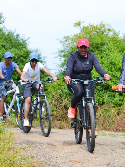 Our cycling crew enjoying the ride through the rustic landscapes of Ramanagara.