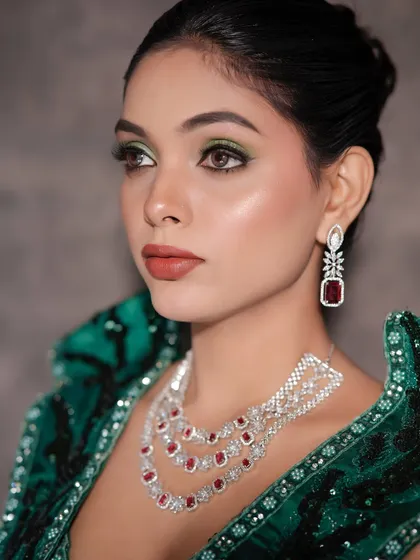 A side profile highlighting the sharp contour and the shimmer of the eyeshadow.