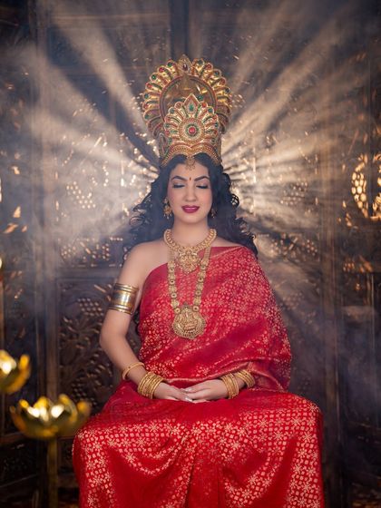 A serene and meditative pose. The makeup is designed to look beautiful even with eyes closed, showcasing the smooth application and rich color.