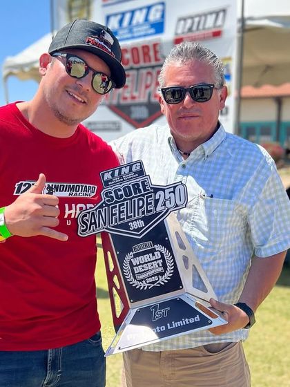 Another shot with the hard-earned trophy. Moments like these are a testament to the teamwork and dedication it takes to compete at this level of desert racing.