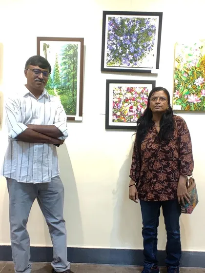 Posing with a visitor at the CKP gallery.