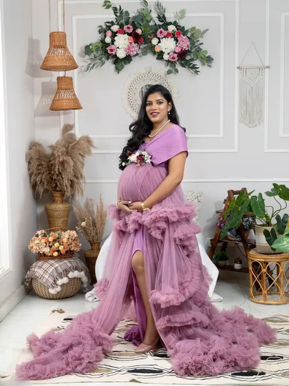 A confident and radiant pose, showcasing the beautiful slit in the lavender gown. She looks like a true goddess.
