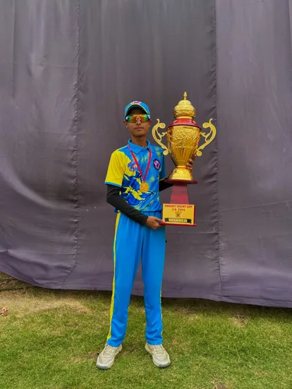 Another champion from our academy with the winner's trophy.