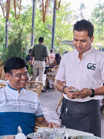 Another shot of the warm interaction between my staff and a guest. I believe in service with a genuine smile.