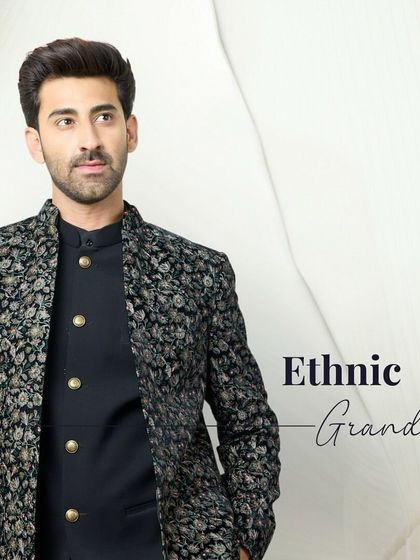 Ethnic grandeur in a two-piece set. A black kurta is layered with a jacket featuring intricate floral embroidery, creating a look of timeless sophistication.