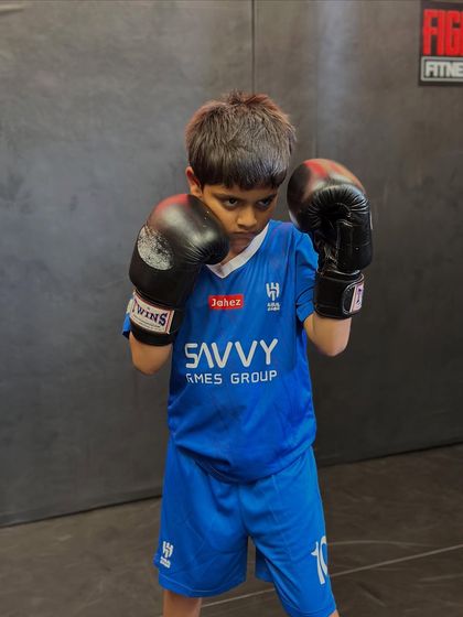 The fighting stance of a future champion. Even our youngest students learn proper form and technique from day one. This focus on fundamentals is key to their success.