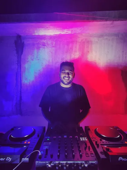 The DJ booth is my command center. From here, I mix Hip Hop, House, and Techno to build the energy and keep the party going strong.