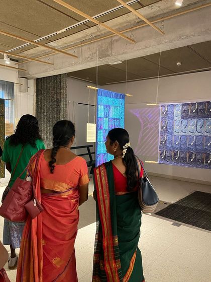 Glimpses from our "We Together Work" exhibition, where hand-printed textiles hang like art. These panels, created with the Bábbarra Women's Centre, tell ancestral stories through the medium of fabric.