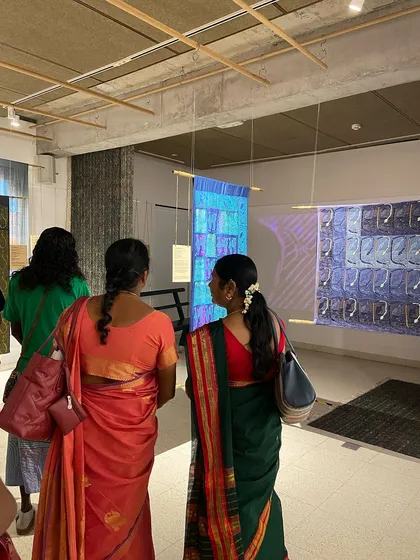 Glimpses from our "We Together Work" exhibition, where hand-printed textiles hang like art. These panels, created with the Bábbarra Women's Centre, tell ancestral stories through the medium of fabric.