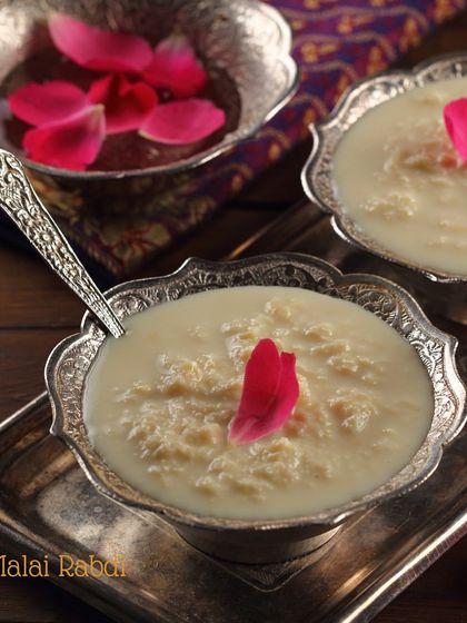 Our Malai Rabdi is pure comfort in a bowl. It's slow-cooked to achieve a thick, creamy texture and garnished with rose petals for a touch of elegance.