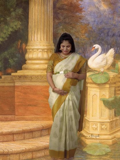 A painterly masterpiece. This portrait, inspired by classic Indian art, features a mom-to-be in a traditional saree in a serene, artistic setting.