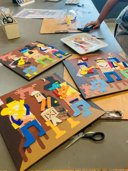 A trio of finished Picasso-inspired collages, each showing a unique interpretation of the "Three Musicians."