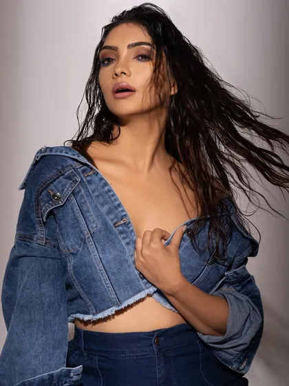 Denim can be so much more than casual. For this shoot, I went for an edgy, deconstructed look with a cropped denim jacket and a wet-hair look to highlight a raw and powerful fashion statement.