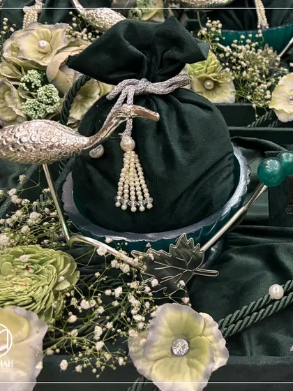 The Heron Bowl, shown here as a set of two, is a popular choice for wedding return favors. The intricate craftsmanship and nature-inspired design offer a touch of serene elegance to thank your guests.