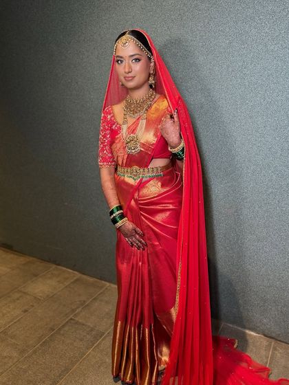 The bride with her veil, adding a layer of traditional grace to her already stunning look.