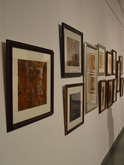 An installation shot of Vidya Bhushan's framed works, showing the careful hanging and lighting that enhances each piece.