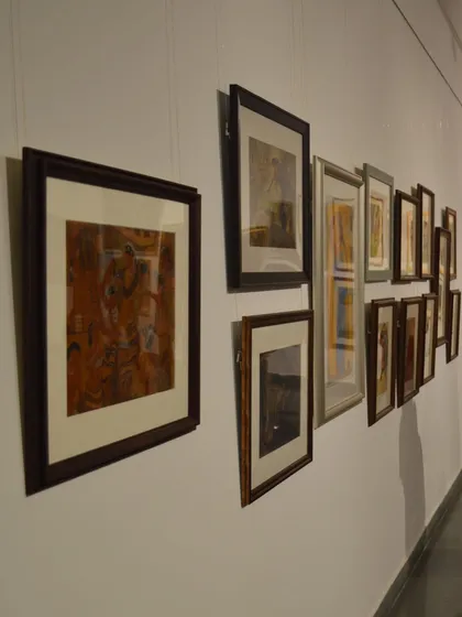 An installation shot showing a row of framed artworks by Vidya Bhushan.