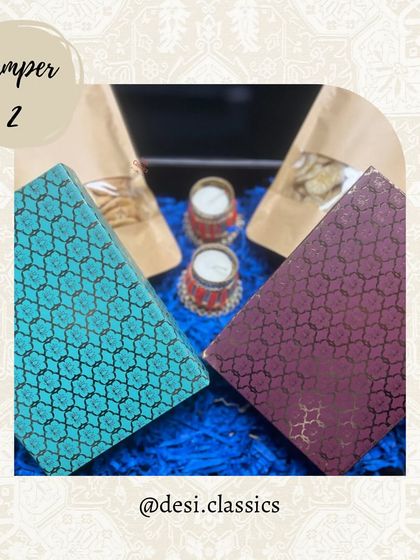 Our Diwali Hamper 2 is a classic choice, with two beautiful mithai boxes, snack pouches, and diyas, all packed in a festive tray.