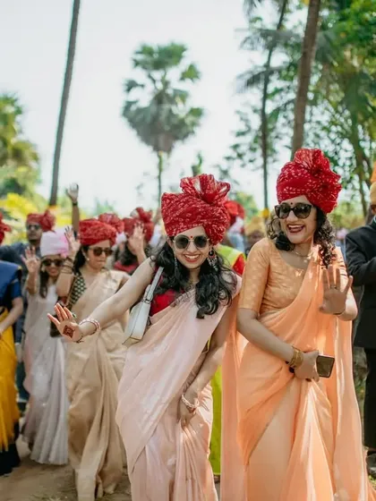 The "baraat" or groom's procession, with guests in colorful turbans dancing and celebrating.