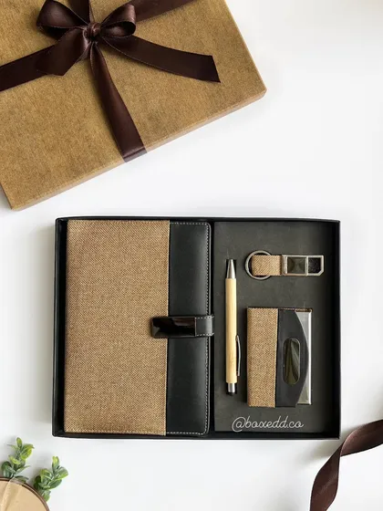 A classy corporate gift set featuring a diary with a jute and leather-finish cover, a bamboo pen, and a matching card holder and keychain. This set can be fully customized with a company's logo.