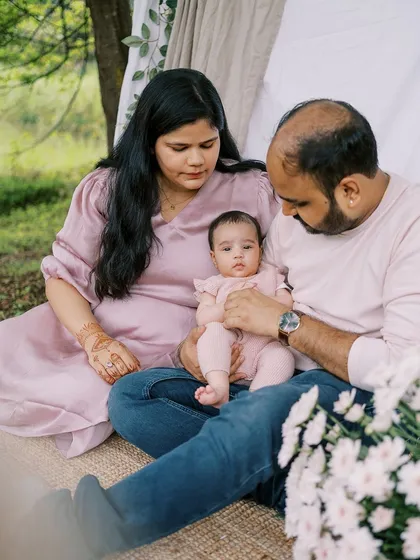 Another angle from the same three-month outdoor session, showing the family's loving interaction.