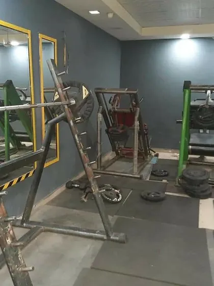 The free weights section is the foundation of strength. We have squat racks, barbells, and plenty of plates for serious lifters focused on powerlifting and bodybuilding fundamentals.