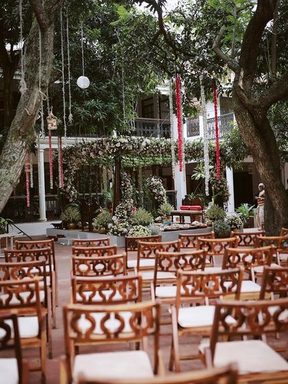 The view from the back of the guest seating, looking towards the lush, floral mandap.