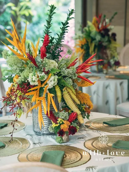 A vibrant tropical centerpiece from the 'Garden of Gaia' tablescape.