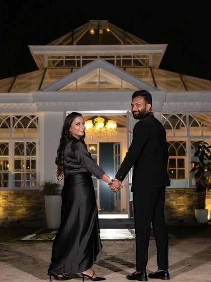 A glamorous night-time shot. The makeup is bold and sophisticated, perfect for a dramatic end to the pre-wedding shoot.