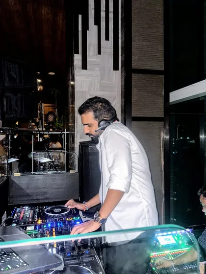 A side profile of me at the Koishii gig, focused on the setup.