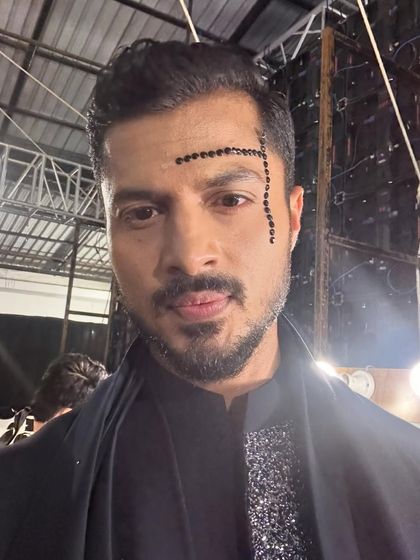 Another backstage selfie, capturing the mood and look before hitting the runway.