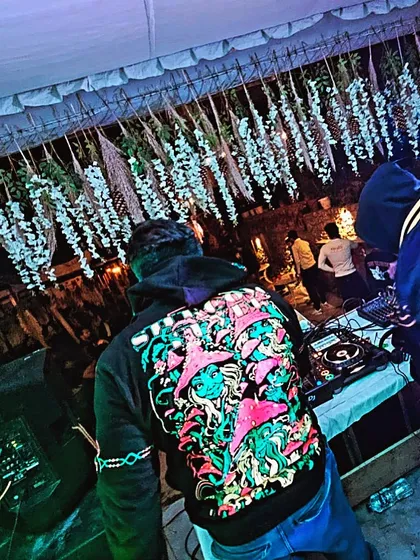 A shot from behind the decks during a techno set in the mountains. Whether it's a massive festival or an intimate gathering, I bring the same focus and energy to every performance.
