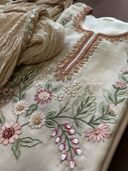 A macro shot of the 3D floral embroidery, a highlight of this custom piece.