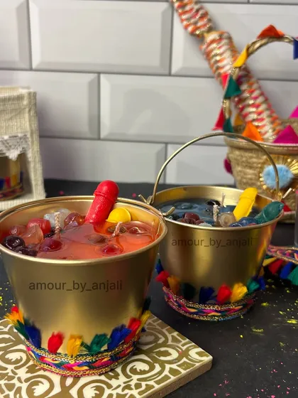 Another look at the festive Holi balti candle. The colorful tassels and realistic details make it a perfect centerpiece for your Holi party.