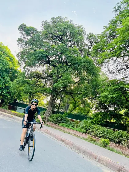 Riding through the green avenues of Delhi.