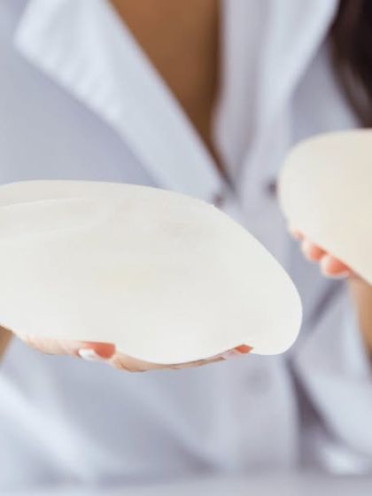 Choosing the right breast implant is a critical step. In this image, you can see two different implant profiles. We will discuss options like silicone or saline, and round or teardrop shapes during your consultation.