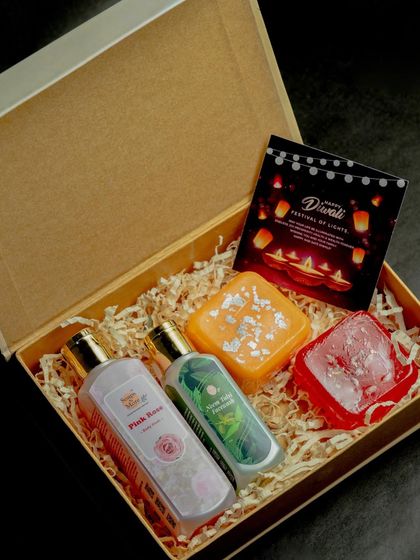 A vibrant Diwali hamper designed for a complete bathing experience. It includes Oudh bodywash, Saffron facewash, and two of my special edition barfi and halwa soaps.