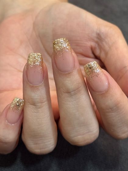 A still shot of the classic gold glitter fade. This look is perfect for any celebration.