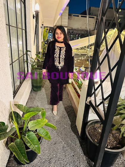 A client in a beautiful velvet suit with a choker-style neckline. This is a very chic and modern take on winter ethnic wear.