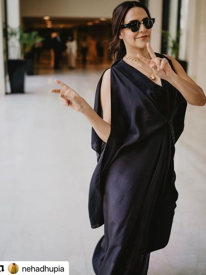 A fun, candid shot of Neha Dhupia. This shows the relaxed and collaborative atmosphere I maintain on set while ensuring the hairstyle remains perfect.