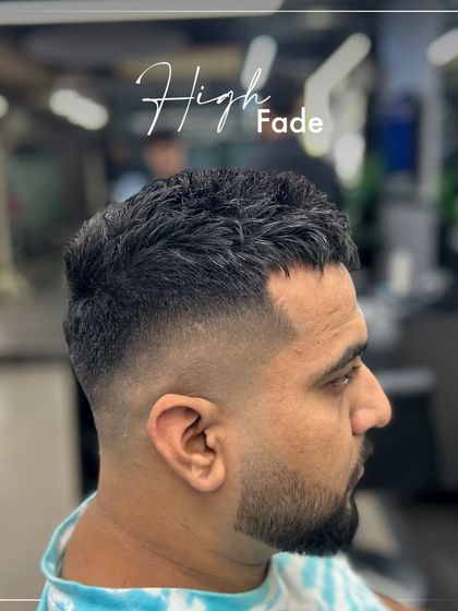 A classic high fade. This haircut is all about precision, with the fade starting high on the sides for a clean, sharp look. It's a versatile cut that is always in style.