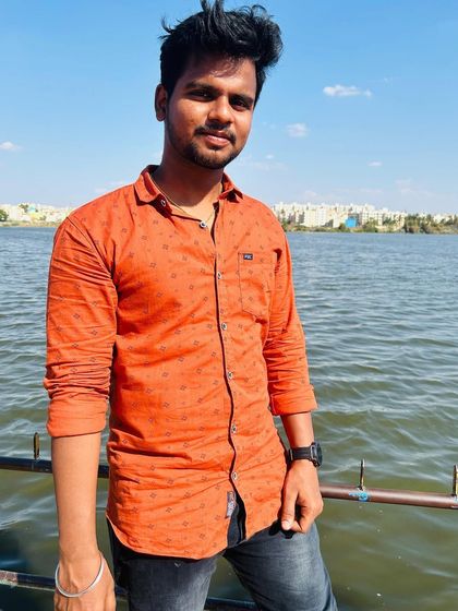 Posing by the calm waters of Madiwala Lake.