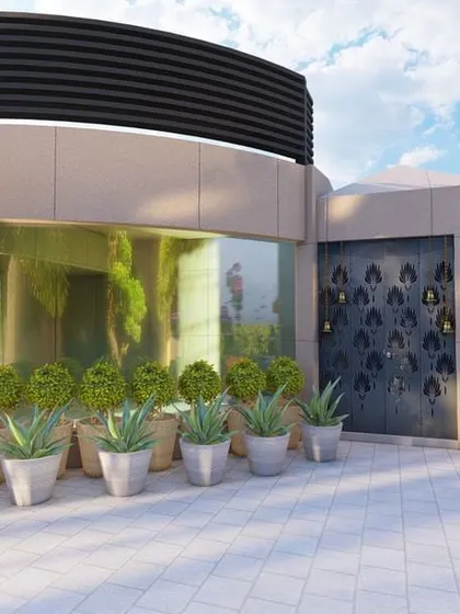 This terrace design emphasizes an abundance of greens with various textures, including manicured topiary, flowering plants, and even a bonsai tree, creating a sophisticated and diverse garden space.