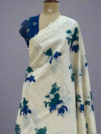 A close-up of the Kota checks saree with blue and green floral prints.
